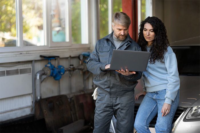 Employee standing with customer